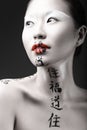 Beautiful Asian girl with white skin, red lips and Royalty Free Stock Photo