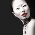 Beautiful Asian girl with white skin, red lips and Royalty Free Stock Photo