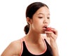 Beautiful Asian healthy girl eat red apple Royalty Free Stock Photo