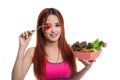 Beautiful Asian healthy girl enjoy eating salad. Royalty Free Stock Photo