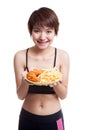 Beautiful Asian healthy girl with french fries and fired chicken Royalty Free Stock Photo