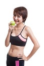 Beautiful Asian healthy girl with red apple. Royalty Free Stock Photo