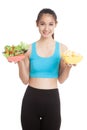 Beautiful Asian healthy girl salad and potato chips Royalty Free Stock Photo