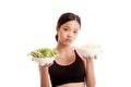 Beautiful Asian healthy girl salad and potato chips Royalty Free Stock Photo