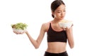 Beautiful Asian healthy girl salad and potato chips Royalty Free Stock Photo