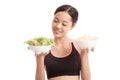 Beautiful Asian healthy girl salad and potato chips Royalty Free Stock Photo