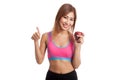 Beautiful Asian healthy girl thumbs up with red apple Royalty Free Stock Photo