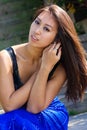 Beautiful Asian Model Sitting in a Blue Dress Royalty Free Stock Photo