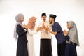 muslim family shake hand on idul fitri celebration