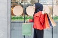 Beautiful Asian Muslim Woman Hijab with Shopping Bags on City Walking Shopping Street Royalty Free Stock Photo