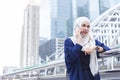 Beautiful asian muslim woman talking telephone in city Royalty Free Stock Photo