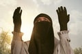 Beautiful asian muslim woman in traditional dress praying Royalty Free Stock Photo