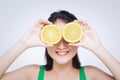 Beautiful asian portrait of young woman with oranges. Healthy food concept. Skin care and beauty. Vitamins and minerals Royalty Free Stock Photo