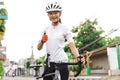 beautiful asian road bike cyclist showing thumb up Royalty Free Stock Photo
