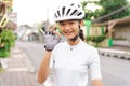 beautiful asian road bike cyclist showing thumb up Royalty Free Stock Photo