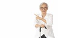 Beautiful asian senior woman with good personality wearing eyeglasses,pointing finger at the empty copy space aside,Healthy old