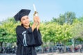 Beautiful asian student girl celebrate her graduation with cap a Royalty Free Stock Photo