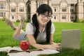 Beautiful Asian student learns at field Royalty Free Stock Photo