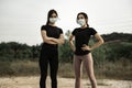 Beautiful asian teenagers doing exercise while wearing face mask