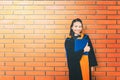 Beautiful asian university graduate student woman holding certificate