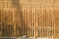 Beautiful Asian village scenery. Rows of cow dung sticks are drying in the sun