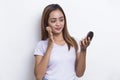 Beautiful asian woman applying powder at makeup of cosmetic isolated on white background Royalty Free Stock Photo