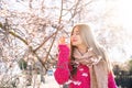 Beautiful asian woman in autumn cherry blosom garden in New Zealand