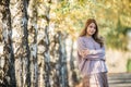 Beautiful asian woman with autumn leaves, flower and fall yellow leaves background at  Christchruch, New Zealand Royalty Free Stock Photo