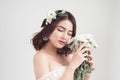 Beautiful asian woman bride on grey background. Closeup portrait Royalty Free Stock Photo