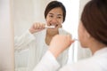 Beautiful asian woman brushing her teeth happily Royalty Free Stock Photo