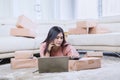 Beautiful Asian woman calling while working Royalty Free Stock Photo