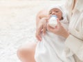 A beautiful Asian woman, carrying her newborn baby with love and cherish Royalty Free Stock Photo