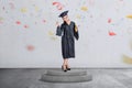 Beautiful asian woman celebrate her graduation with cap and diploma scroll Royalty Free Stock Photo