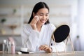 Beautiful asian woman cleaning her face with toner Royalty Free Stock Photo