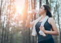 Beautiful asian woman drinking water bottle Royalty Free Stock Photo