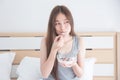 Woman eating yogurt with fruits for breakfast Royalty Free Stock Photo