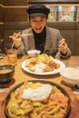 Beautiful asian woman enjoy eating Japanese food in restaurant Royalty Free Stock Photo