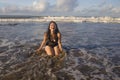 Beautiful Asian woman enjoying sand and sea - young happy and attractive Korean girl in bikini having fun at tropical beach during Royalty Free Stock Photo