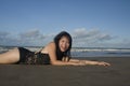 Beautiful Asian woman enjoying sand and sea - young happy and attractive Korean girl in bikini having fun at tropical beach during Royalty Free Stock Photo