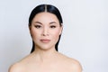 Beautiful asian woman face with clean fresh skin, nude makeup, cosmetology, healthcare, beauty and spa