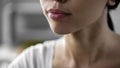 Beautiful asian woman face closeup, natural skin care products, lip balm, herpes