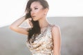 Beautiful asian woman in fashion luxury shiny dress in desert