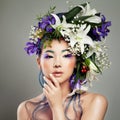 Beautiful Asian Woman with Flower on her Head Royalty Free Stock Photo