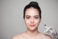 Beautiful asian woman gets beauty facial injections. Face aging Royalty Free Stock Photo