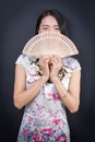 Beautiful Asian woman with a hand fan Royalty Free Stock Photo