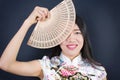 Beautiful Asian woman with a hand fan Royalty Free Stock Photo