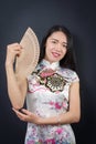 Beautiful Asian woman with a hand fan Royalty Free Stock Photo