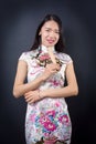 Beautiful Asian woman with a hand fan Royalty Free Stock Photo