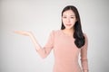 Beautiful asian woman with happy smile showing or presenting pro Royalty Free Stock Photo