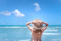 Beautiful Asian woman with hat enjoy spending time  on tropical sand beach blue sea, resting and relaxing on summer holiday Royalty Free Stock Photo
